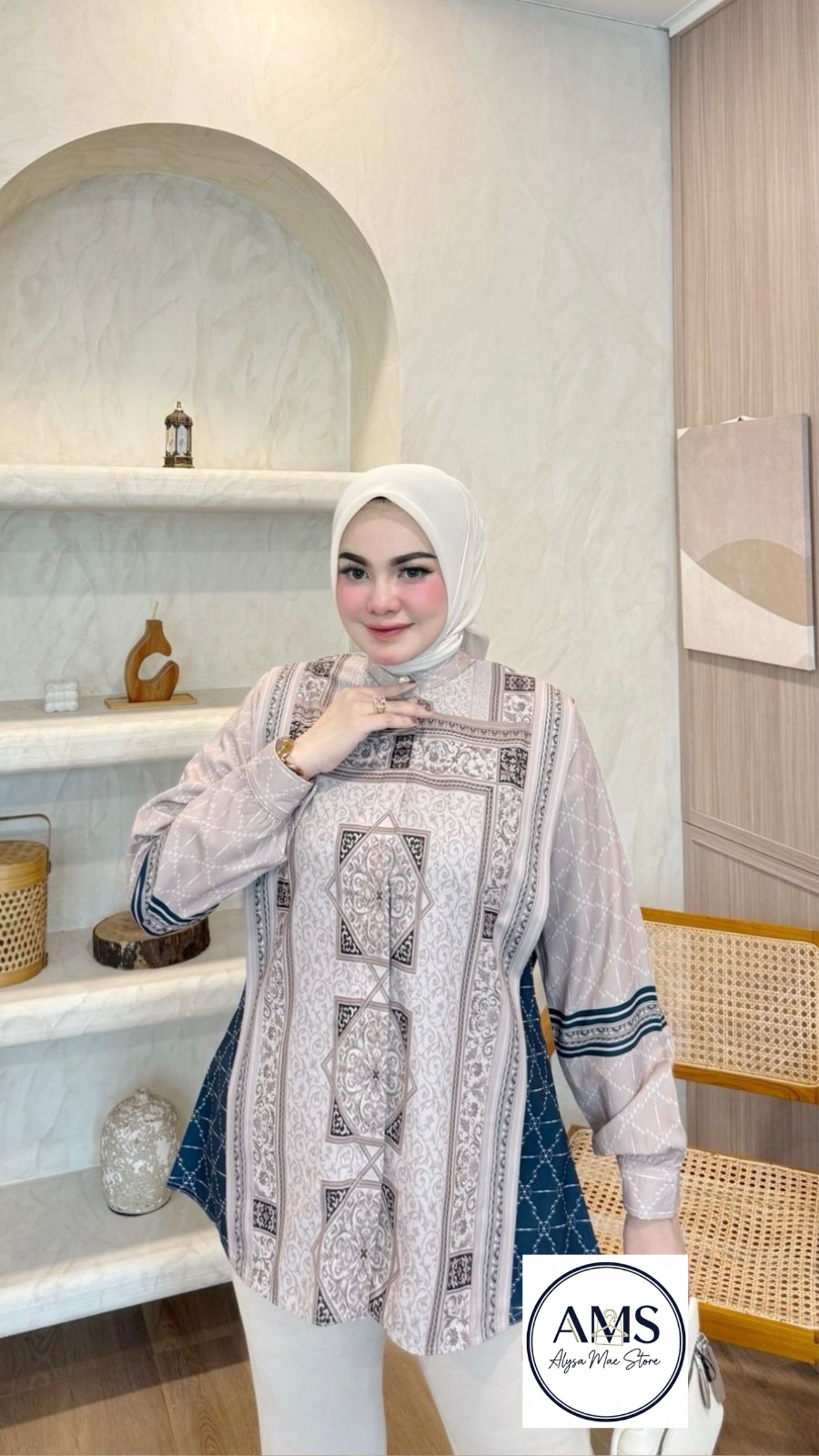 Model showcasing the Sandra Shirt V8 with elegant flows, in a stylish interior setting.